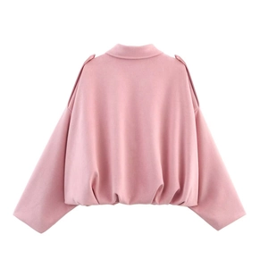 Rear view detail of pink bomber jacket showing soft suede texture and elasticated hem