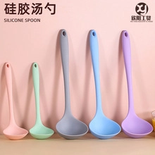 Set of pastel food-grade silicone spoons in pink, green, gray, and blue with hanging holes