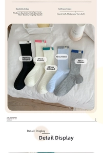 Detail of five-pair knit cotton crew socks set with colorful ribbed cuffs and cartoon labels