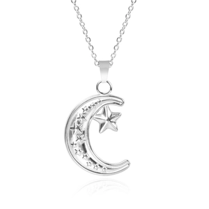 Macro shot of silver crescent moon and star pendant with polished steel finish