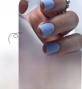 Macro detail of matte sky blue square press-on nails set with 24 pieces in satin texture