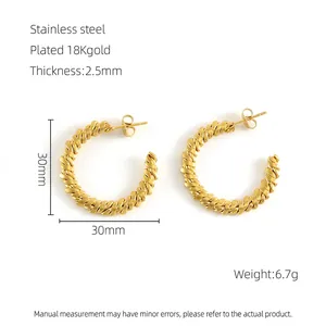 Detail view of 30mm twisted C-shape earrings in 18K gold-plated stainless steel