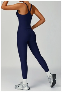 Detail view of dark blue ribbed yoga set with high waist compression leggings and racerback top
