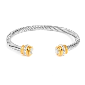 Titanium steel cable twist bangle with gold accents and sparkling cubic zirconia stones