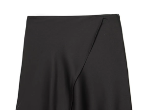 Detail of the overlapping wrap waist design on this black asymmetric skirt