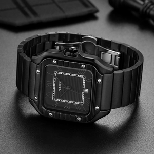 Close-up of square black watch dial with visible bezel screws and metal clasp detail