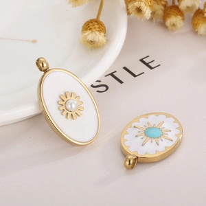 Golden oval stainless steel pendants with enamel, pearl, and turquoise sunburst details