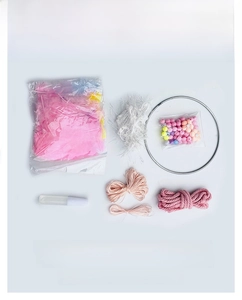 Pink DIY dream catcher kit with metal ring, feathers, beads and floral decor set
