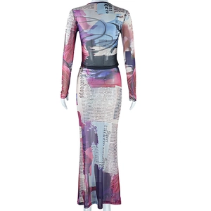 Detail view of the abstract newspaper print and sheer mesh texture on the back of the dress