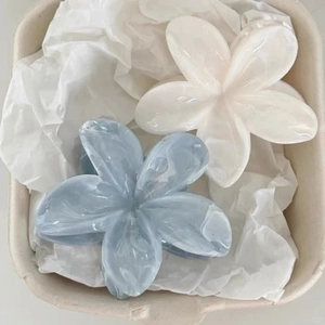 Floral frangipani hair claw clips set in light blue and cream white marble resin