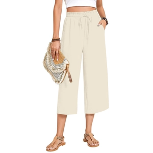 Detail of high waisted linen pants with elastic drawstring waist and breathable fabric
