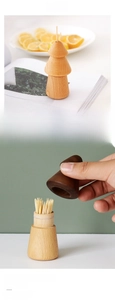 Detail of creative pine-shaped toothpick holders in walnut and beech wood finishes