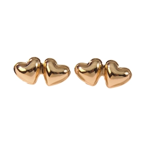 Minimalist double heart golden stud earrings with polished mirror finish on white background