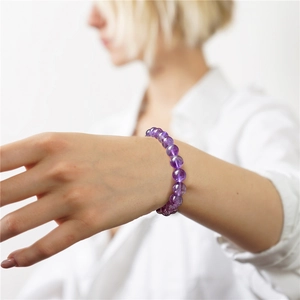 8mm natural amethyst stone bead bracelet on a model wrist for a minimalist retro look