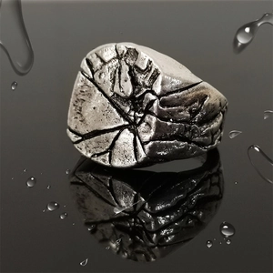 Vintage cracked metal ring for men with antique silver finish and reflective water droplets