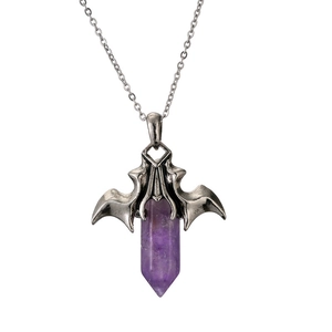 Macro view of purple hexagonal crystal pillar with silver bat wing pendant on chain