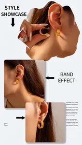 Close-up of triple-layered C-shaped gold-plated titanium earrings with textured finish