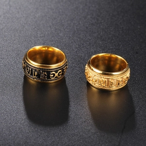 Rotating stainless steel spinner ring with engraved Sanskrit mantra in gold and black finish