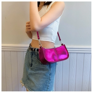 Close-up of metallic purple PU crossbody bag featuring sleek silver hardware and stitching