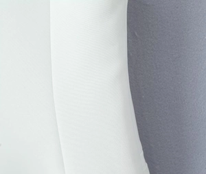 Detailed macro shot of white twill fabric texture and high-quality seam craftsmanship