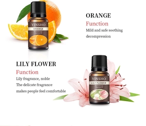 Aromatherapy essential oil set, orange and lily fragrance, glass bottle, home diffuser use.