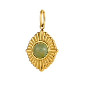 Detailed view of oval gold sunburst pendant featuring a vibrant green center stone