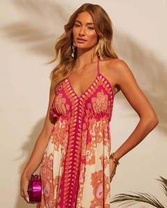 Detail of bohemian paisley print on a halter V-neck maxi dress with lightweight fabric