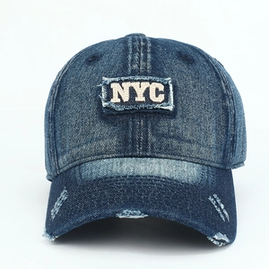Navy denim baseball cap with NYC embroidery and vintage distressed details on white background