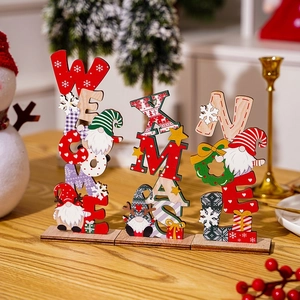 Three wooden Christmas gnome table signs featuring Welcome, Xmas and Noel lettering