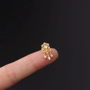 Golden chandelier cartilage piercing with opal and marquise cubic zirconia detail