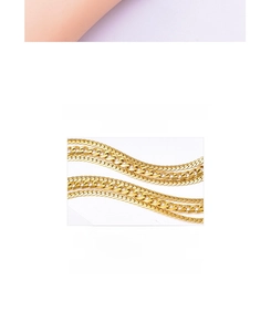 Detail of multi-layered golden titanium flat snake chain bracelet for women