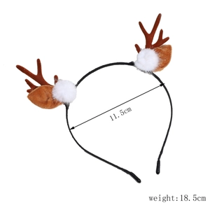 Detail view of 11.5cm wide Christmas reindeer antlers headband with plush brown ears