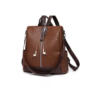 Detailed side view of vintage brown woven PU leather backpack with decorative zippers