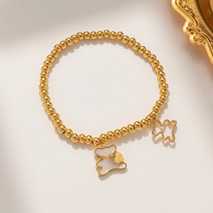 Golden beaded teddy bear bracelet with heart charm and mother-of-pearl inlay