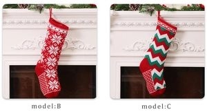 Detail of knitted Christmas stockings in snowflake and chevron patterns for gift storage