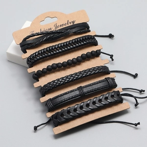Set of 6 vintage black braided leather bracelets and bead jewelry on kraft card