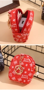 Close-up of a red PU leather mini coin purse with Good Luck cat print and gold clasp