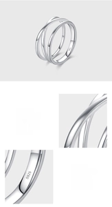 Close-up of S925 sterling silver stamp and polished multi-layered crossover ring detail