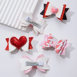 Collection of cute Valentine glitter bow hair clips with pink hearts and sparkling fabric