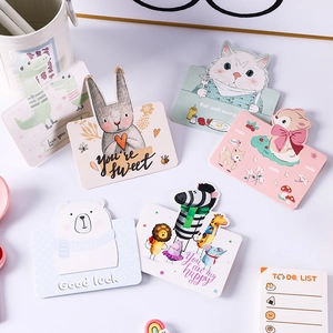 Flat lay of colorful cartoon animal greeting cards and a to-do list for kids