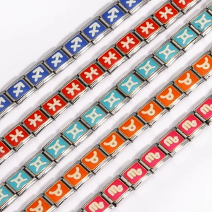 Italian charm bracelet links in stainless steel with colorful zodiac signs on white backdrop