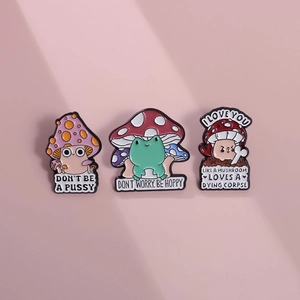 Three-piece set of cute mushroom enamel pins with funny quotes on pink background