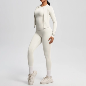 Detailed view of women's ivory 3-piece yoga set including slim jacket and high waist pants
