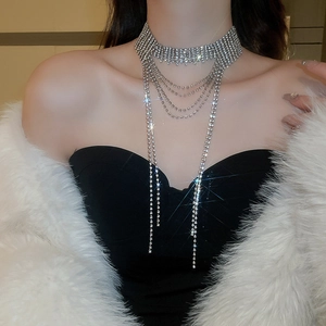 Close-up of elegant silver layered rhinestone fringe choker necklace on a model