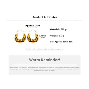 Detail showing vintage leopard print enamel U-shape hoop earrings in golden alloy
