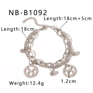 Macro detail of silver double-layer zodiac bracelet with Taurus pendant and dimensions