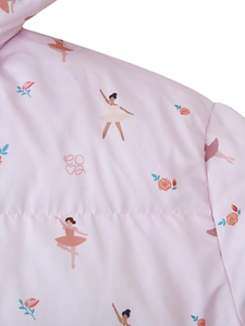 Detail of pink quilted fabric with printed ballet dancers, flowers and love lettering
