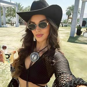 Chic festival outfit featuring metal oval sunglasses and vintage silver boho bolo tie