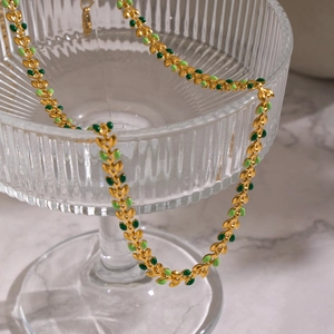Vintage 18K gold-plated stainless steel necklace with green enamel leaf-shaped links