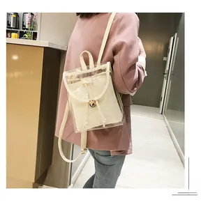 Detail of transparent PVC backpack with cream leather liner and gold metal buckle